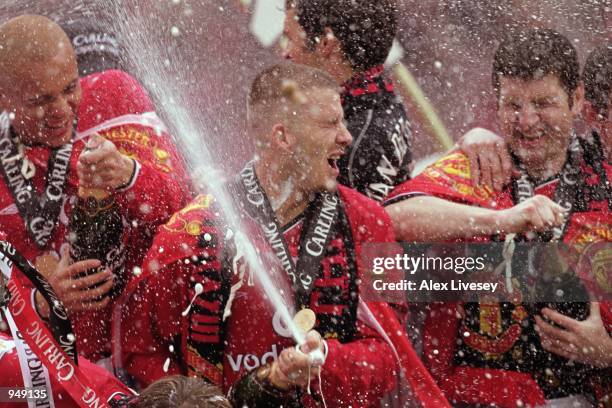David Beckham of Manchester United celebrates winning the league title with team-mates after the FA Carling Premiership match against Derby County...