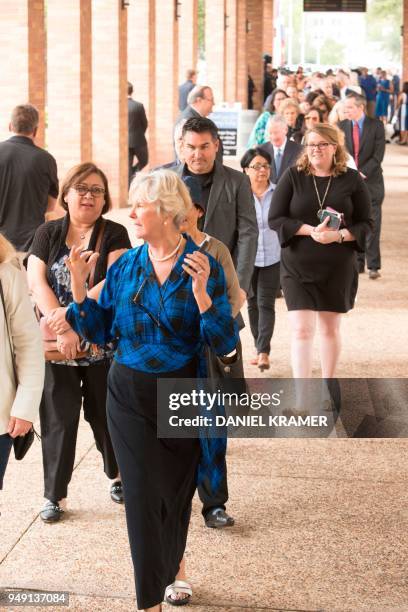Well wishers wait in line at the Second Baptist Church in Houston to go through a security check, for a bus which will take them to St. Martin's...