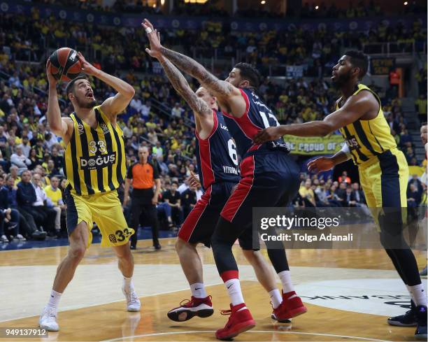 Nikola Kalinic and Jason Thompson, #1 of Fenerbahce Dogus in action with Janis Timma, #6 and Ilimane Diop, #12 of Kirolbet Baskonia Vitoria Gasteiz...