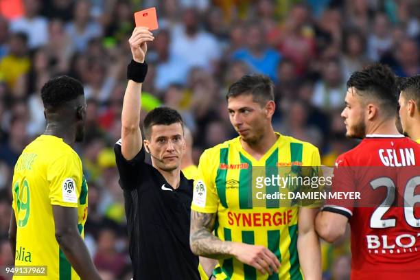 French referee Benoit Bastien shows a red card to Nantes' Argentinian forward Emiliano Sala during the French L1 football match Nantes against Rennes...