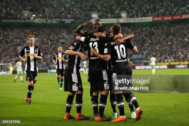 Lars Stindl of Moenchengladbach celebrates with his team-mates after scoring his teams first goal to make it 1-0 during the Bundesliga match between...