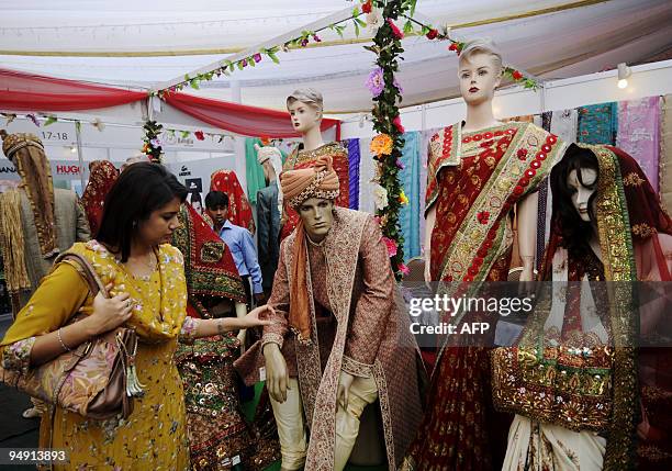 Bangladeshi woman visits a bridal apparel and jewelry exhibition in Dhaka on Dcember 19, 2009. The festival highlighted bridal clothing and...