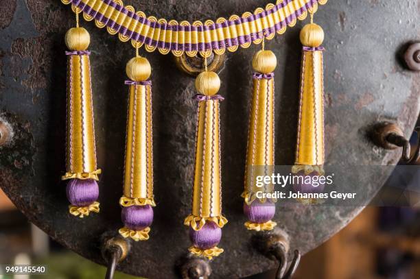 passementerie, five finished empire fringes, gold, purple, decorated with spun vellum flowers, attached to crepine or woven border, munich, bavaria, germany - embellishment border stock pictures, royalty-free photos & images