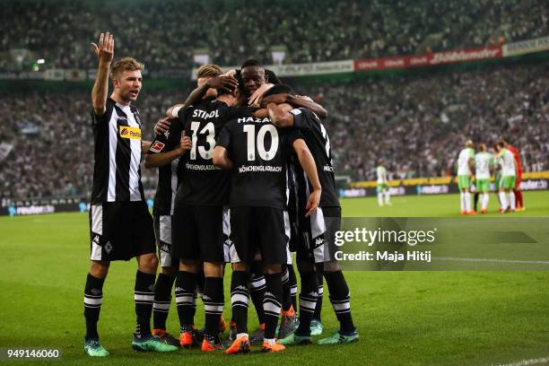 Lars Stindl of Moenchengladbach celebrates with his team-mates after scoring his teams first goal to make it 1-0 during the Bundesliga match between...