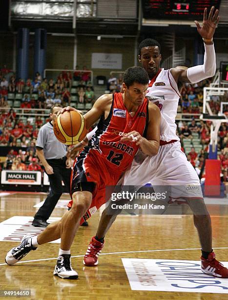 Kevin Lisch of the Wildcats drives to the basket past Cortez Groves of the 36'ers during the round 13 NBL match between the Perth Wildcats and the...