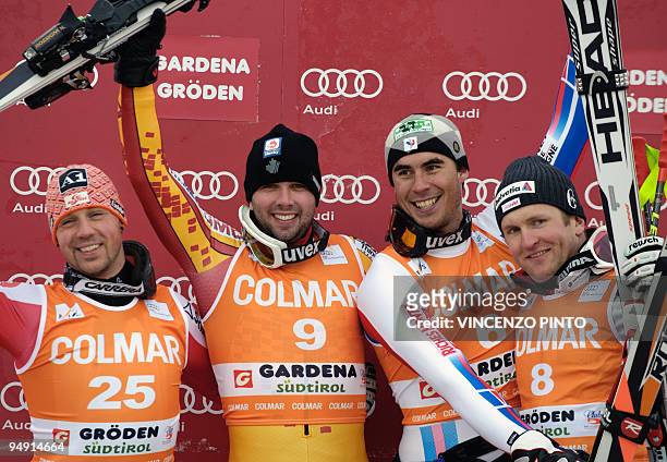 Second placed Austrian Mario Scheiber, winner Canadian Manuel Osborne-Paradis, third placed France's Johan Clarey and Swiss Ambrosi Hoffmann pose on...
