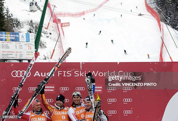 Second placed Austrian Mario Scheiber, winner Canadian Manuel Osborne-Paradis, third placed France's Johan Clarey and Swiss Ambrosi Hoffmann pose on...