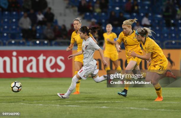 Hasegawa Yui of Japan challenges for the ball with Clare Polkinghorne and Ellie Carpenter of Australia during the AFC Women's Asian Cup final between...