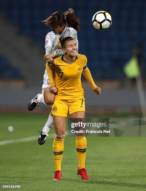 Emi Nakajima of Japan and Stephanie Catley of Australia jump to the ball during the AFC Women's Asian Cup final between Japan and Australia at the...