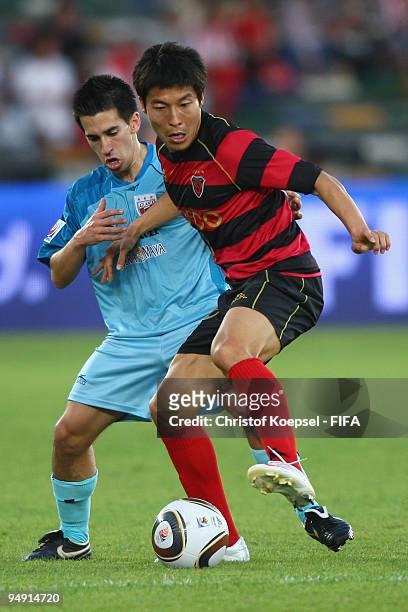 Fernando Navarro of Atlante challenges Kim Jung Kyum of Pohang Steelers during the FIFA Club World Cup third place match between Pohang Steelers and...