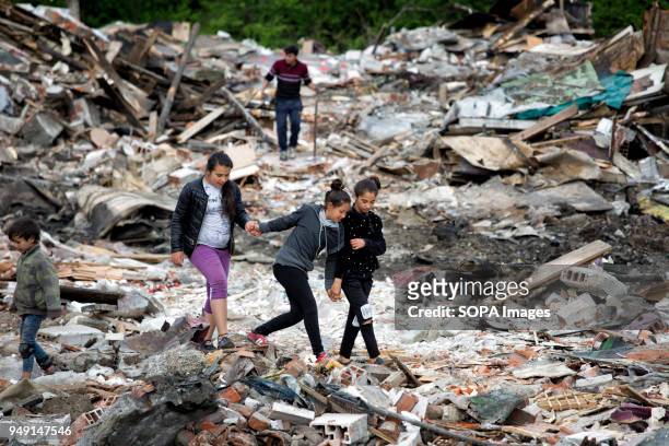 Girls look for items of value in the debris after homes were razed in a Roma quarter of Sofia. At least 20 homes, deemed illegal were destroyed by...