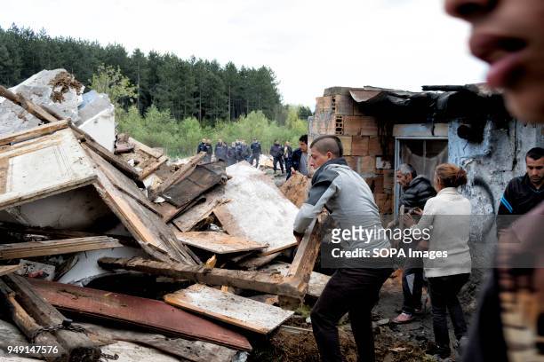 Residents clear debris after homes were razed in a Roma quarter of Sofia. At least 20 homes, deemed illegal were destroyed by the local municipality,...