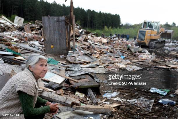 Resident watches as her home and others are razed in a Roma quarter of Sofia. At least 20 homes, deemed illegal were destroyed by the local...