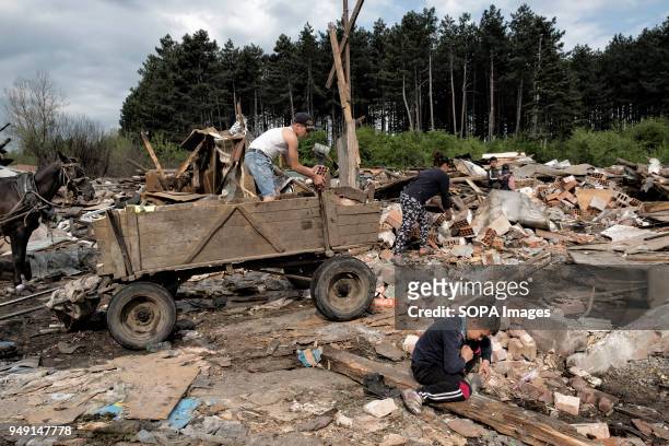 Resident collect materials after their homes were razed in a Roma quarter of Sofia. At least 20 homes, deemed illegal were destroyed by the local...