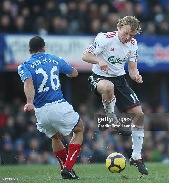 Dirk Kuyt of Liverpool challenges Tal Ben Haim of Portsmouth during the Barclays Premier League match between Portsmouth and Liverpool at Fratton...