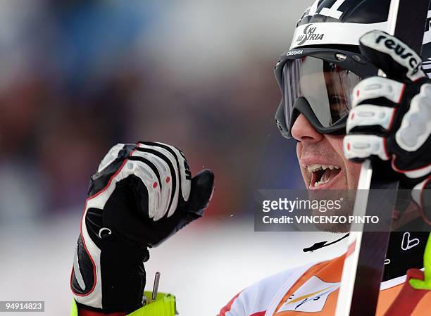 Austrian Mario Scheiber reacts in the finish area after taking the second place of the men's World Cup downhill race in Val Gardena on December 19,...
