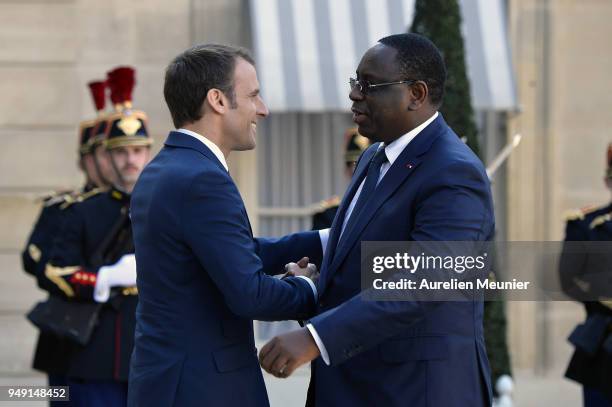 French President Emmanuel Macron welcomes Senegal President Macky Sall for a meeting at Elysee Palace on April 20, 2018 in Paris, France. Senegal...