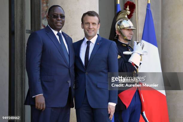 French President Emmanuel Macron welcomes Senegal President Macky Sall for a meeting at Elysee Palace on April 20, 2018 in Paris, France. Senegal...