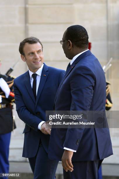 French President Emmanuel Macron welcomes Senegal President Macky Sall for a meeting at Elysee Palace on April 20, 2018 in Paris, France. Senegal...