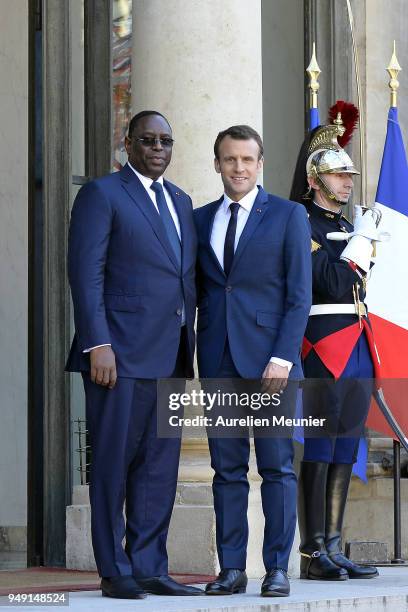 French President Emmanuel Macron welcomes Senegal President Macky Sall for a meeting at Elysee Palace on April 20, 2018 in Paris, France. Senegal...