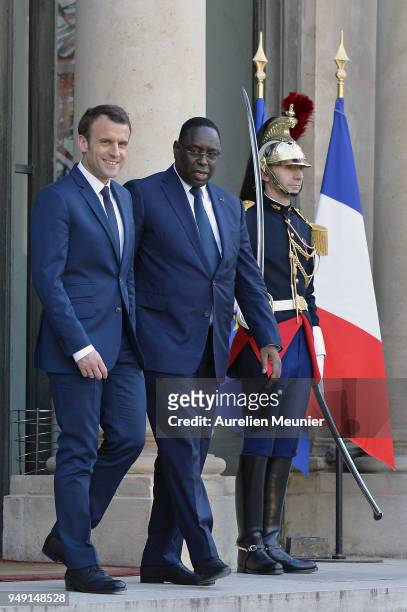 French President Emmanuel Macron escorts Senegal President Macky Sall after a meeting at Elysee Palace on April 20, 2018 in Paris, France. Senegal...