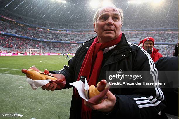 Uli Hoeness, President of Bayern Muenchen fried sausages for the supporters prior to the Bundesliga match between Bayern Muenchen and Hertha BSC...