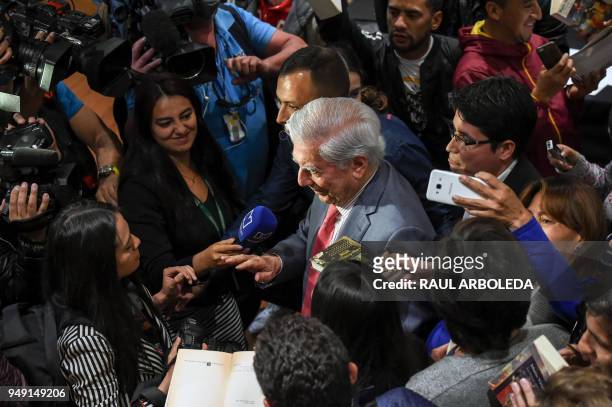 Peruvian Nobel prize-winning writer, Mario Vargas Llosa is surrounded by journalists and fans, during the presentation of his book "La llamada de la...