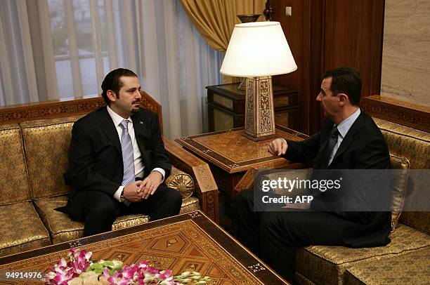 Syrian President Bashar al-Assad speaks with Lebanese Prime Minister Saad Hariri during a meeting in Damascus on December 19, 2009. Hariri arrived in...