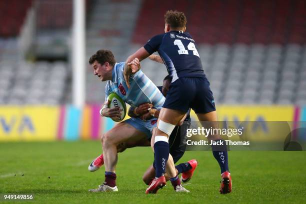 Fg Off Sam Randle of the Royal Air Force Seniors is tackled at Twickenham Stoop on April 20, 2018 in London, England.