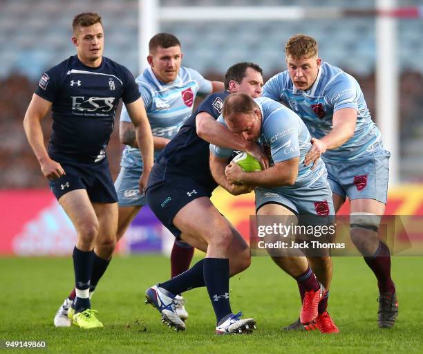 Flt Lt Rob Bell of the Royal Air Force Seniors is tackled at Twickenham Stoop on April 20, 2018 in London, England.