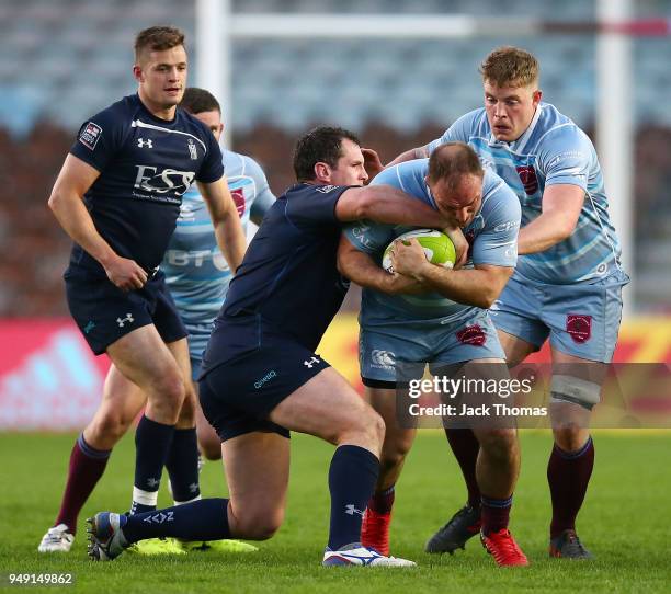 Flt Lt Rob Bell of the Royal Air Force Seniors is tackled at Twickenham Stoop on April 20, 2018 in London, England.