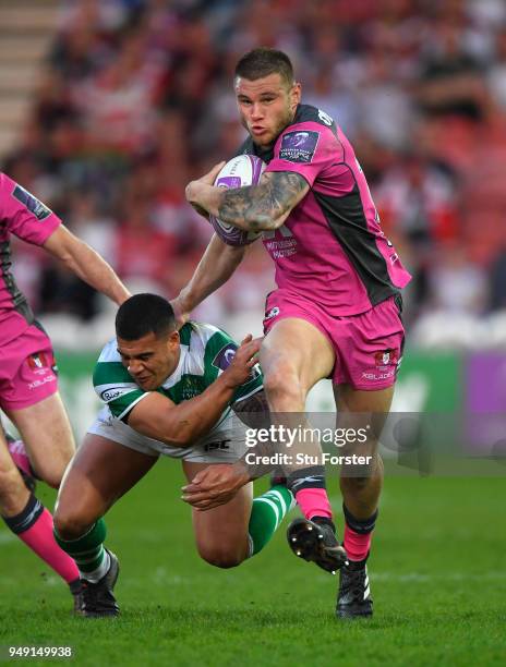 Jason Woodward of Gloucester barges through the tackle of Josh Matavesi of the Falcons their first try during the European Challenge Cup Semi-Final...