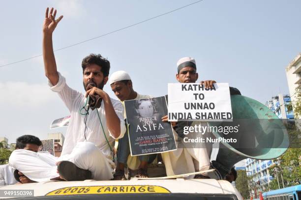 Indian Muslim activists hold placards during a protest calling for justice following the rape and murder of an eight-year-old girl in the Indian...