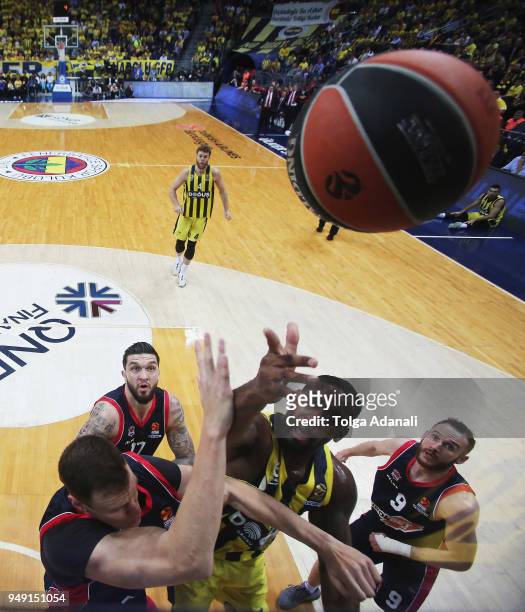 Brad Wanamaker, #11 of Fenerbahce Dogus in action with Marcelinho Huertas, #9 and Vincent Poirier, #17 of Kirolbet Baskonia Vitoria Gasteiz during...