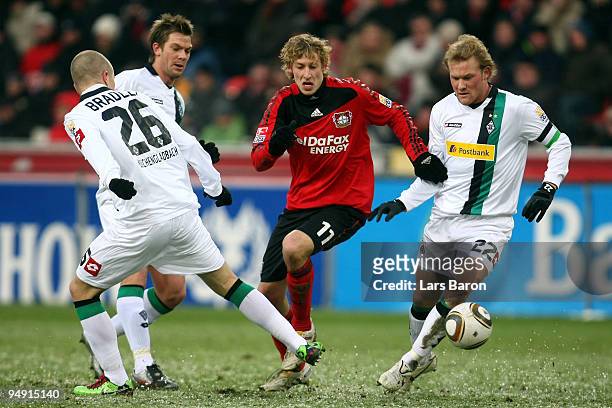Stefan Kiessling of LEverkusen is challenged by Michael Bradley, Thorben Marx and Tobias Levels of Moenchengladbach during the Bundesliga match...