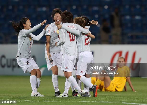 Aya Sameshima and Saki Kumagai of Japan celebrate with the team winning the AFC Women's Asian Cup final between Japan and Australia at the Amman...