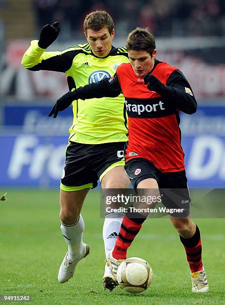 Pirmin Schwegler of Frankfurt battles for the ball with Edin Dzeko of Wolfsburg during the Bundesliga match between Eintracht Frankfurt and VFL...