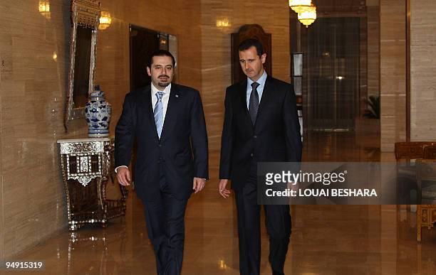 Syrian President Bashar al-Assad greets Lebanese Prime Minister Saad Hariri upon his arrival for a meeting in Damascus on December 19, 2009. Hariri...