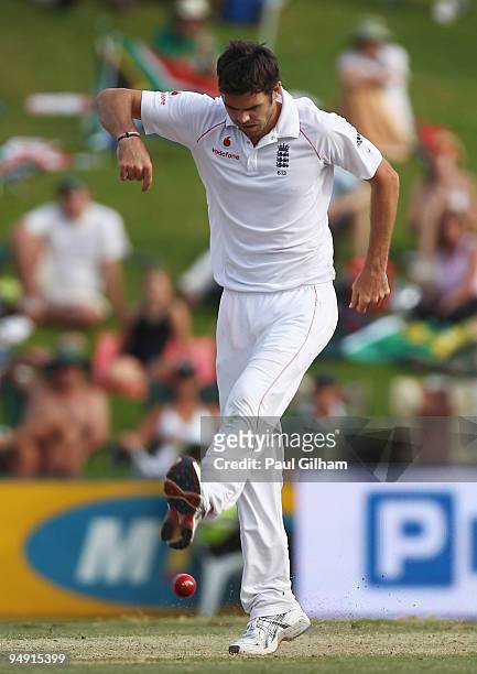 James Anderson of England kicks the ball after bowling out Hashim Amla of South Africa for 100 runs during day four of the first test match between...