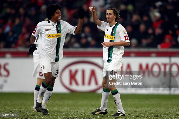 Roel Brouwers of Moenchengladbach celebrates scoring his teams first goal with team mate Dante during the Bundesliga match between Bayer Leverkusen...