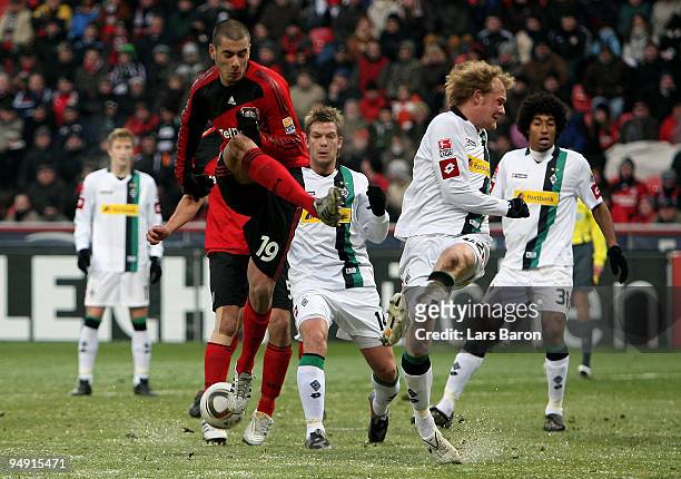 Eren Derdiyok of Leverkusen misses the ball next to Tobias Levels of Moenchengladbach during the Bundesliga match between Bayer Leverkusen and...