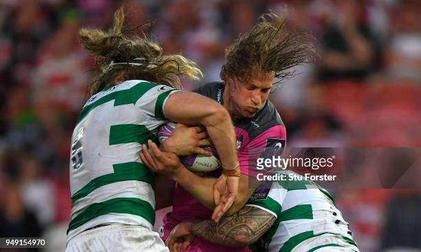 Billy Twelvetrees of Gloucester is tackled by Evan Olmstead during the European Challenge Cup Semi-Final match between Gloucester and Newcastle...