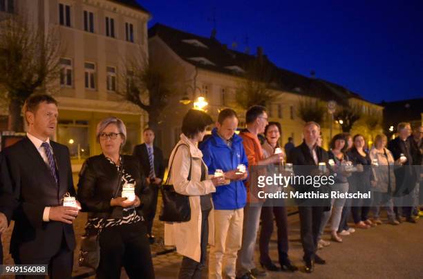 People protesting a nearby gathering of neo-Nazis and form a human chain on April 20, 2018 in Ostritz, Germany. Police are expecting over 1,000...