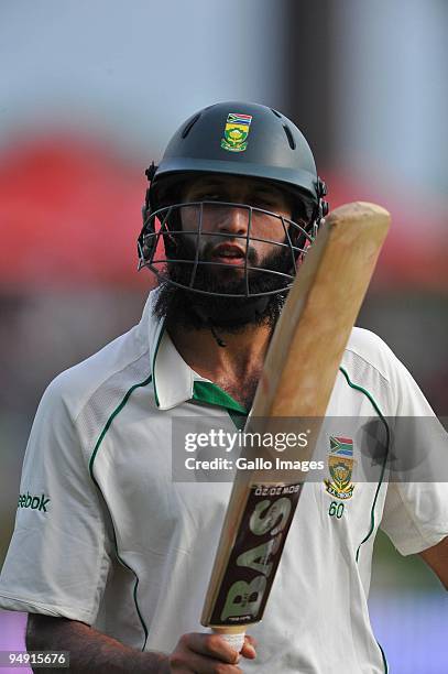 Hashim Amla of South Africa walks off after his century during day 4 of the 1st Test match between South Africa and England from Supersport Park on...