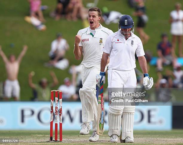 Morne Morkel of South Africa celebrates taking the wicket of Andrew Strauss of England for 1 run during day four of the first test match between...