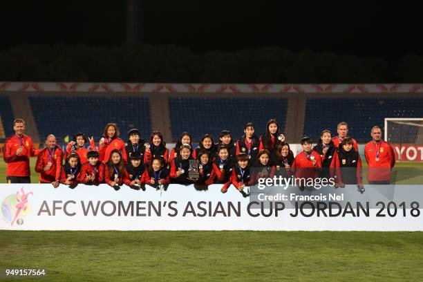 Players of China pose with the trophy after winning the AFC Women's Asian Cup third place match between China and Thailand at the Amman International...
