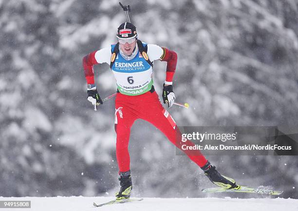 Dominik Landertinger of Austria competes during the Men's 10km Sprint in the e.on Ruhrgas IBU Biathlon World Cup on December 19, 2009 in Pokljuka,...