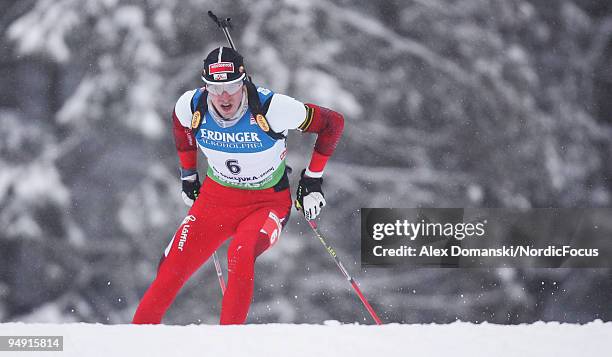 Dominik Landertinger of Austria competes during the Men's 10km Sprint in the e.on Ruhrgas IBU Biathlon World Cup on December 19, 2009 in Pokljuka,...