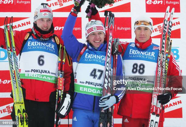 Winner Ivan Tcherezov of Russia poses on the podium together with Dominik Landertinger of Austria who placed second and Thomas Frei of Switzerland...