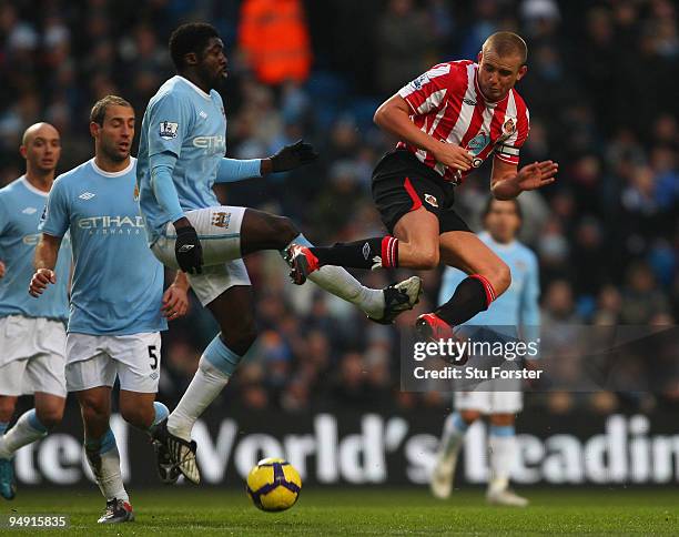 Manchester City defender Kolo Toure challenges Lee Cattermole during the Barclays Premier League game between Manchester City and Sunderland at City...